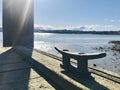 Wooden floating dock with mooring bitts under sunshine morning.