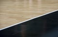 Wooden floor basketball arena. Wooden floor of sports hall with marking lines line on wooden floor indoor, gym court Royalty Free Stock Photo