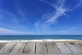 Wooden floor with beautiful blue sky over tropical sandy beach scenery for background Royalty Free Stock Photo