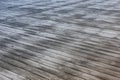 Wooden floor being covered with frost and sunshine covering the ground