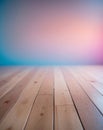 A wooden floor with a blurred colorful gradient background Royalty Free Stock Photo