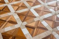 wooden floor with natural stone inlay in a geometric design