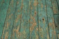 Wooden floor with old shabby turquoise paint