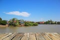 Wooden floor on the river with blue sky background, Thailand. Royalty Free Stock Photo