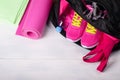 On a wooden floor a sports bag with pink things in it is opened Royalty Free Stock Photo