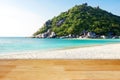 Wooden floor with white sand beach island and blur mountain hill background landscape Royalty Free Stock Photo