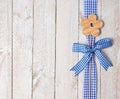 Wooden flower and blue ribbon