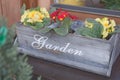 Wooden flower box with text garden Royalty Free Stock Photo