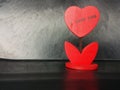 Wooden flower heart shape on black background Royalty Free Stock Photo