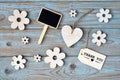 Wooden flowers and heart on a old wooden background with thank you label and and black chalk boardempty space layout Royalty Free Stock Photo