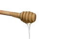 Sweet fresh honey flows from the wooden ladle.