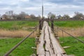 Wooden foot-bridge over small river Tomakivka Royalty Free Stock Photo