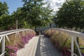 Wooden footbridge decorated with flowers Royalty Free Stock Photo