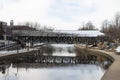 Wooden Footbridge over the DuPage River along the Naperville Riverwalk during Winter in Naperville Illinois Royalty Free Stock Photo