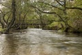 Wooden footbridge over the River Dove at Dovedale Royalty Free Stock Photo