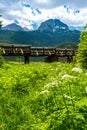 Wooden footbridge over stream against background of Meded Peak and Glacial Black Lake. Durmitor National Park. Montenegro