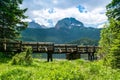 Wooden footbridge over stream against background of Meded Peak and Glacial Black Lake. Durmitor National Park. Montenegro