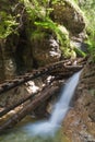 Wooden footbridge over a waterfall