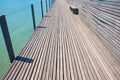 wooden footbridge with small bench, horizontal