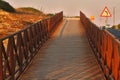 Wooden footbridge at sunset Royalty Free Stock Photo