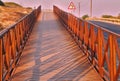 Wooden footbridge at sunset Royalty Free Stock Photo