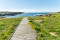 Wooden footbridge to the coast Royalty Free Stock Photo