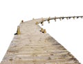 Wooden footpath bridge from old logs on stilts on white background Royalty Free Stock Photo