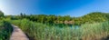 Wooden footpath at Plitvice lakes, Croatia. Road in the forest near beautiful lakes. Peaceful place in national park Royalty Free Stock Photo