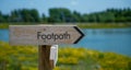 Wooden footpath sign in the Cotswolds, Gloucestershire, England Royalty Free Stock Photo