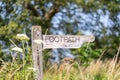 A wooden footpath sign in the English countryside Royalty Free Stock Photo