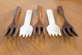 Wooden forks on wooden background
