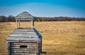 Wooden fortress in the field, old Russian wooden structure, village tower in the field Royalty Free Stock Photo