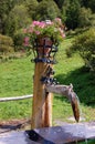 Wooden Fountain with Flowers - Engadine Switzerland Royalty Free Stock Photo