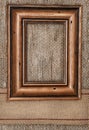 Wooden frame on the burlap with sacking ribbon Royalty Free Stock Photo