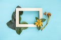 Wooden frame decorate with flower and green leaf Royalty Free Stock Photo