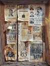 A Wooden Frame Full of Wanted Posters
