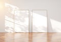 Wooden frame leaning in bright white interior with wooden floor mockup 3D rendering