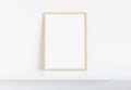 Wooden frame leaning on white shelve in bright interior mockup 3D rendering