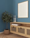 Wooden frame mockup, close up of cozy wooden living room in blue tones, lounge furniture, rattan commode with potted small tree,