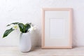 Wooden frame mockup with tender white lily in vase