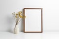 Wooden frame mockup in white minimalistic room with copy space for artwork, photo or print presentation Royalty Free Stock Photo