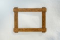 Wooden frame on natural snow background