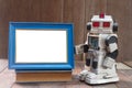 wooden frame and oldrobot Royalty Free Stock Photo