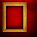 Wooden frame on red paint wall Royalty Free Stock Photo