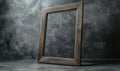 A wooden frame is sitting on a grey wall Royalty Free Stock Photo