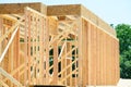 Wooden frame structure house building on a new development framing of under construction Royalty Free Stock Photo