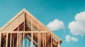 A wooden frame under bright blue sky and fluffy clouds, showcasing the progress of a new construction project Royalty Free Stock Photo