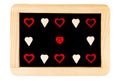 Wooden frame vintage chalkboard isolated on white with red heart shape symbols and smiling emoticon Royalty Free Stock Photo