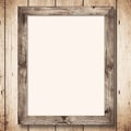 a wooden frame on a wall with a blank sheet of paper Royalty Free Stock Photo