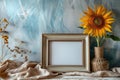 A wooden frame with a white background and a yellow sunflower in a vase Royalty Free Stock Photo